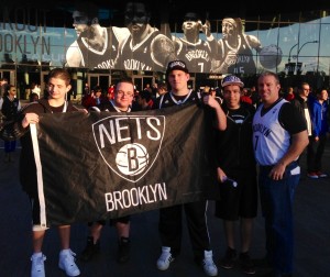 Zachary Cullen in the middle, Michael Cullen on right before the Nets' victory against the Chicago Bulls on Saturday. Photo by Cori Capik for The Brooklyn Ink